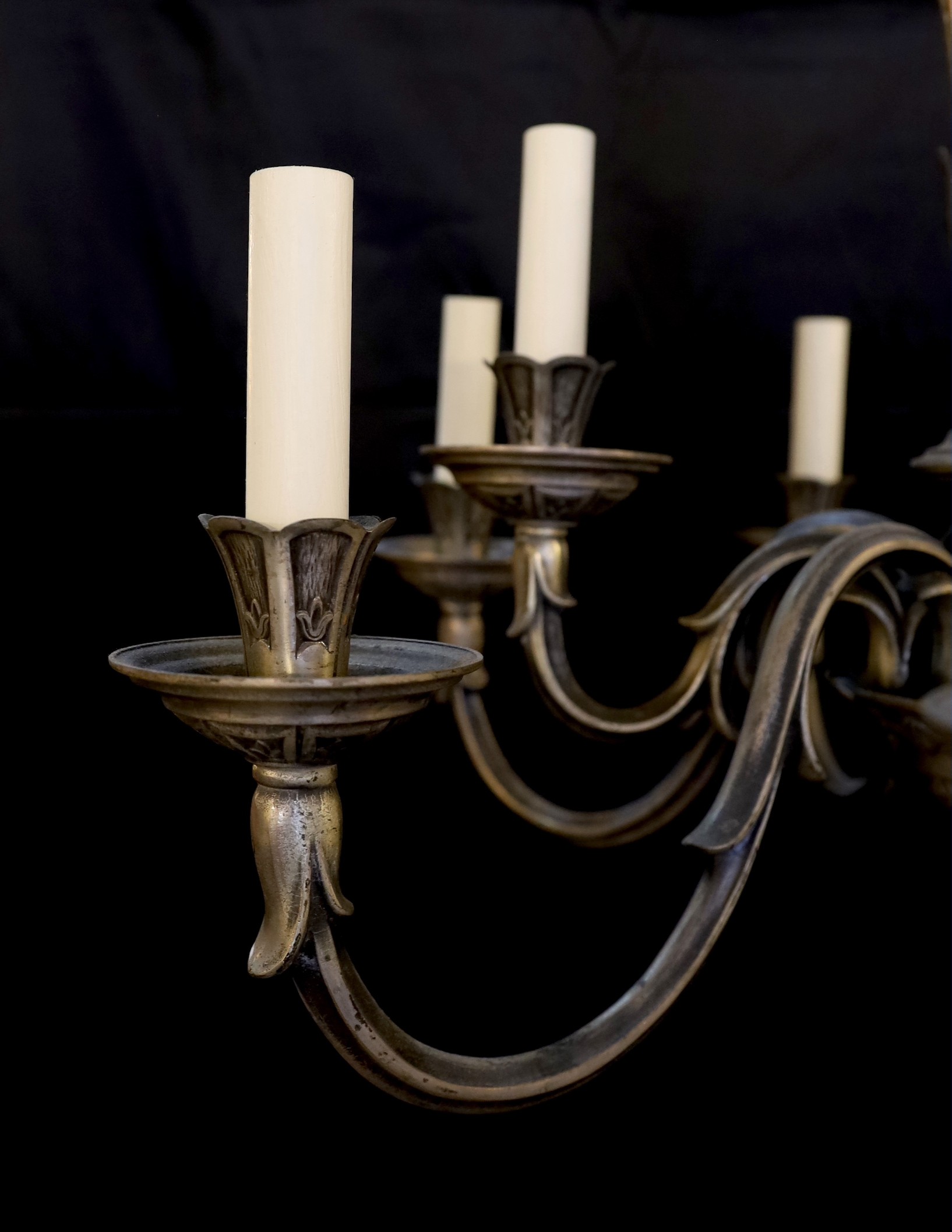 A 1920s French silver bronze nine light chandelier, drop 74cm. width 66cm